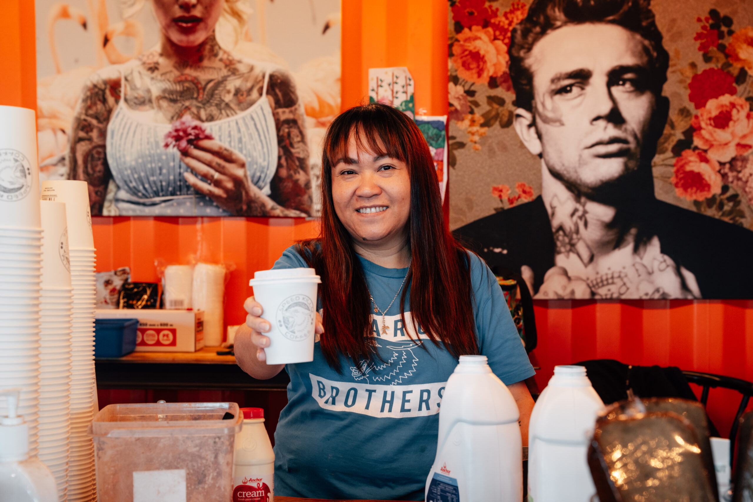 Barista serving coffee in the Speedshop cafe