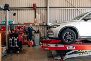 Car in the wheel alignment bay