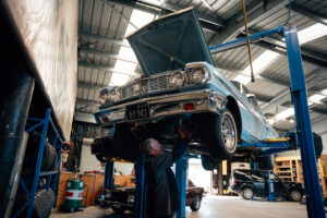 Classic car raised on the hoist