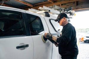 Technician checking a work ute
