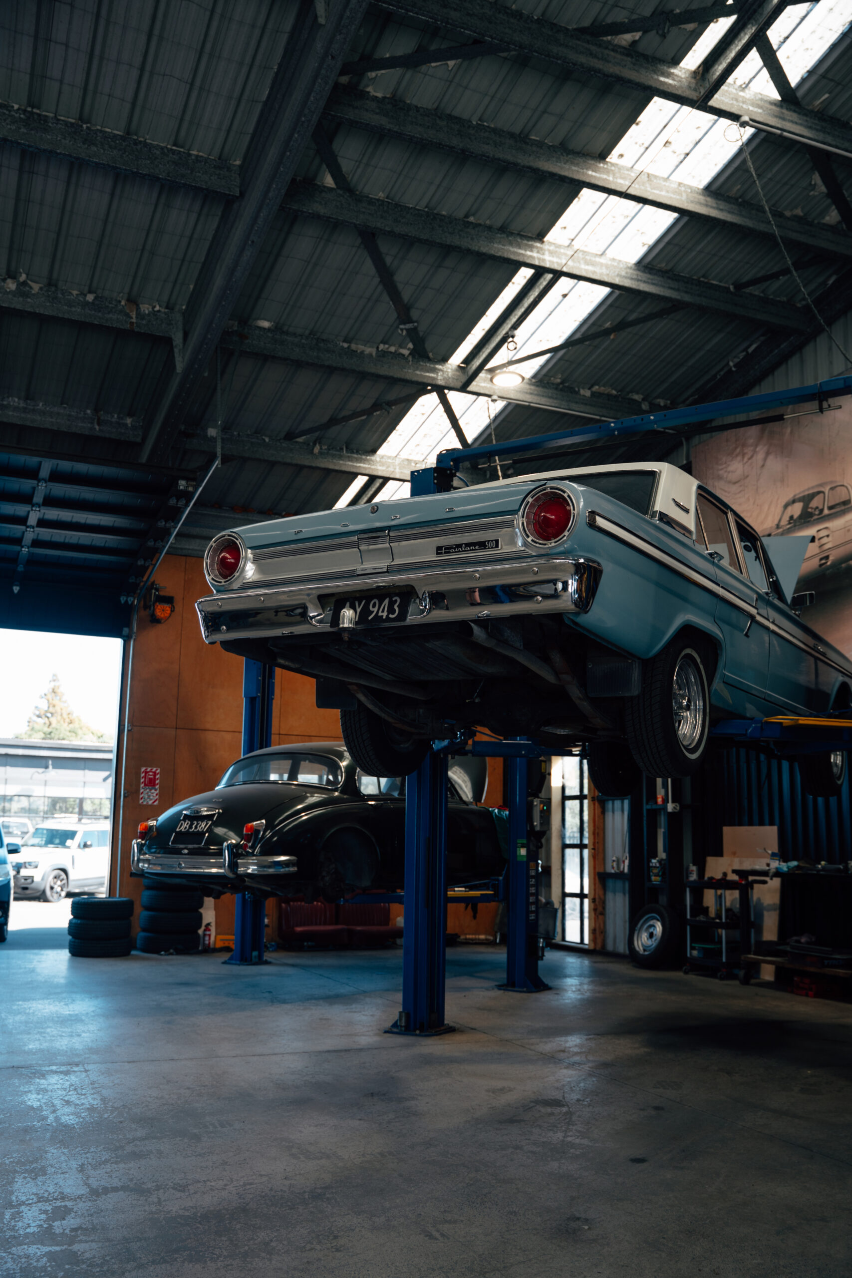 Classic car on the hoist in the Speedshop workshop